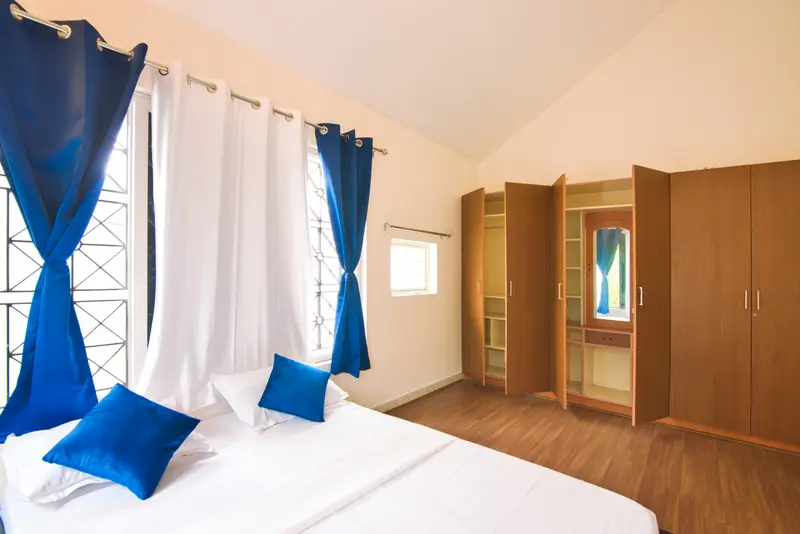 A bedroom with a built-in wardrobe