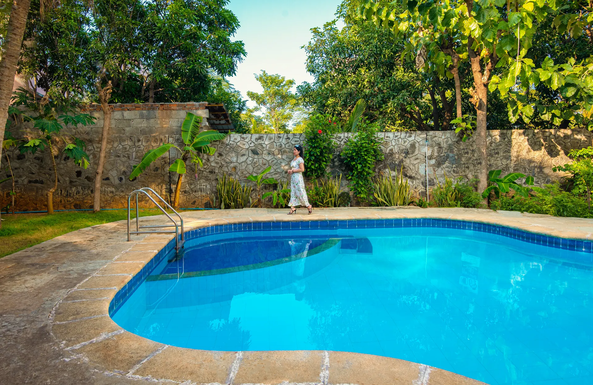 The pool against the garden wall