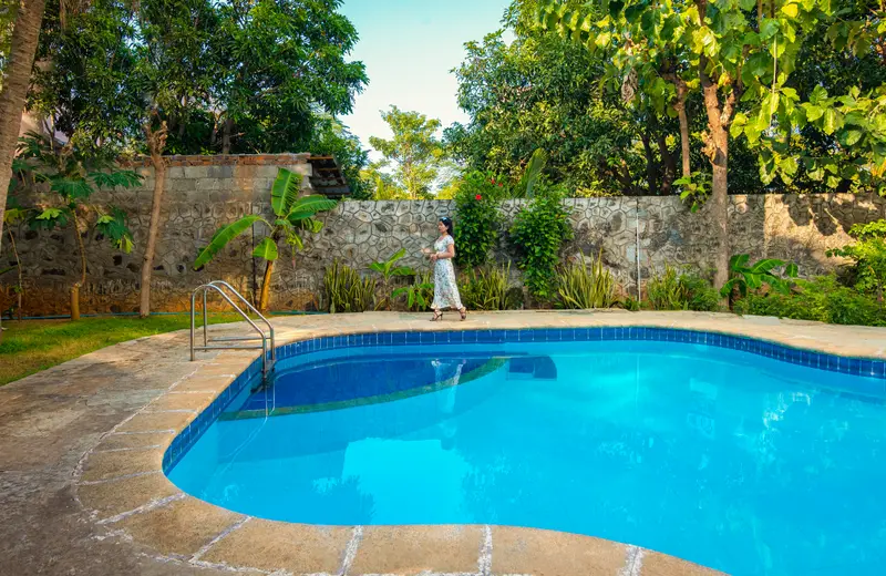 The pool against the garden wall