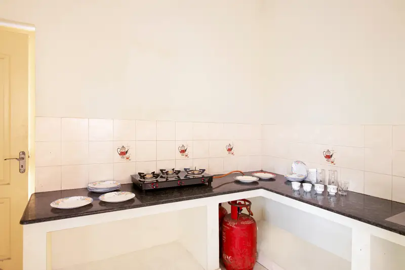 The kitchen counter, stocked with utensils